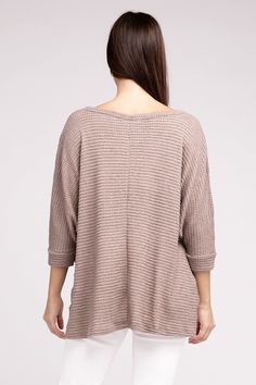 Elevate your spring wardrobe with our Zenana Waffle Knit 3/4 Sleeve Top. This lightweight top features a comfortable oversized fit. The V-neckline and hi-low hem add a touch of elegance, while the side slits provide extra comfort. Dress it up with white jeans or dress pants or keep it casual with denim shorts or jeans. You'll love the versatility of this waffle top! Neckline: V-neckline Features: Side Slits Fabric: Waffle knit texture Hemline: Hi-low hem Sheer: Semi-sheer Sleeve: 3/4 Sleeve Stre V-neck Textured Knit Top For Day Out, Textured Knit V-neck Top For Day Out, Textured Tops For Layering In Fall, Textured Casual Tops For Loungewear, V-neck Textured Knit Tops, Spring Textured Knit Top With Batwing Sleeves, Waffle Knit V-neck Sweater In Loose Fit, Soft Knit V-neck Top For Day Out, Oversized Waffle Knit Tops For Layering