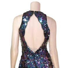 "This 80s-era trophy dress features a fun mermaid scale pattern of iridescent purple sequins and gold beads, a halter neck bodice with open back, and mini length skirt. Perfect for holidays, special occasions, or any time you need to glam it up a bit. Dress is unlined and zips up the back. Best fits size xs or small (please check measurements below). Accessories not included. Payment plans available. Approximate Flat Measurements: Multiply times 2 for bust, waist, and hip measurements. For best Fitted Sleeveless Sequin Dress For Costume Party, Fitted Contrast Sequin Dress For Prom, Glamorous Mermaid Dress For Homecoming, Glamorous Fitted Sequin Dress For Summer, Fitted Backless Dress With Contrast Sequin, Fitted Contrast Sequin Prom Dress, Backless Sequin Mermaid Dress For Prom, Summer Evening Mermaid Dress, Stretch Mermaid Dress For Prom Season Party