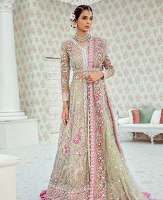 This wedding jacket is hand-worked with pearls, Swarovskis, dabka, nakshi, kora, gold sequins, and crystals. It is matched with a Carnation Pink Color Organza Skirt with embroidered and embellished dupatta finished with a four-sided border. Lehenga can be customized in any color of your choice. Net Suit, Pakistan Bridal, Latest Pakistani Dresses, Pakistan Wedding, Pakistani Women Dresses, Pakistani Dresses Online, Pakistani Fashion Casual, Organza Skirt, Indian Bridal Dress