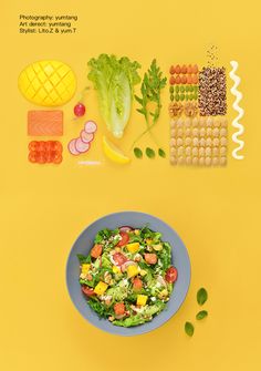 a blue bowl filled with salad on top of a yellow table next to other food items