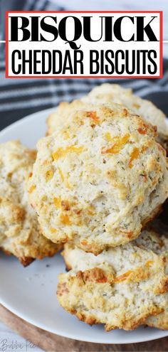 biscuits on a plate with the words biscuit cheddar biscuits in front of it