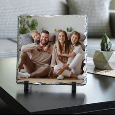 a family photo frame sitting on top of a table