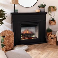 a living room with a fire place and potted plants