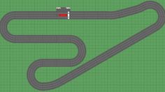 an aerial view of a race track with cars driving on it and one car going down the road