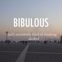 the words biblious ad excessively fondd of drinking alcohol in front of an empty parking lot