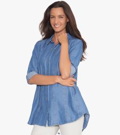 Stunningly designed and crafted using luxurious Tencel® denim, our Between The Lines Tunic is here to revolutionize the way you think of denim shirts! Featuring contrast top stitching, cut-up panels, and handy side seam pockets, this style makes a statement. Step up your style today! This is a limited production item produced in small quantities. If your selected size/color is currently sold out and pre-order is available, pre-order yours today to be first on the list for our next shipment! Denim Blue Tops For Layering, Denim Tops For Layering, Tencel Denim, Contrast Top, Denim Shirts, Be First, Cut Up, Top Stitching, Denim Shirt