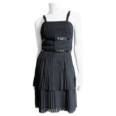 A fabulous black silk dress by Karl Lagerfeld. It has functional, adjustable buckle black patent straps at the shoulders and around the waist and under bust. The 2 layer skirt is finely pleated flaring subtly to the hem. The dress is fully lined in black silk and has center back zipper. Fits sizes Small, Medium. Marked French size 42. Bust 35" Waist 28" Hips Open Length 37" 1990s Chanel, Silk Summer Dress, Chanel Black And White, Halter Cocktail Dress, Layer Skirt, Silk Cocktail Dress, Black Silk Dress, Silk Shift Dress, Woman Clothes