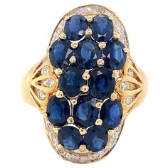 A lovely setting of rich, deep colored sapphires with diamonds in an 18k yellow gold ring. There are twelve individually set sapphires weighing approximately 4.8 ctw (measured in setting). The ring is a size 9.75 but can easily be resized. Colored Sapphires, Sapphire Diamond Ring, 18k Yellow Gold Ring, Yellow Gold Ring, Sapphire Diamond, Yellow Gold Rings, Cocktail Rings, Gold Ring, Diamond Ring