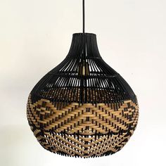 a black and brown lamp hanging from a ceiling