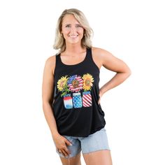 USA Sunflower Tank The perfect USA tank with sunflowers, mason jars and red, white and blue. Wear this black graphic tank with Judy Blue shorts all season. Fabric Content: 65% polyester, 33% viscose Shirt Brand: Bella Canvas Sizing (unisex fit): XS: 0-2, S: 4-6, M: 8-10, L: 12-14, XL: 16-18, 2XL: 20-22 Models:Alicia (short blonde hair): 5'5" size small top, size 4 bottoms Cortney (wavy brown hair with highlights): size 1XL top, size 13 bottoms Actual Measurements: XS: Chest: 29", Length: 24.5" S Usa Tank, Fox Clothing, Gym Tops, Short Blonde, Brown Hair With Highlights, Short Blonde Hair, Blue Shorts, Small Tops, Graphic Tees Women