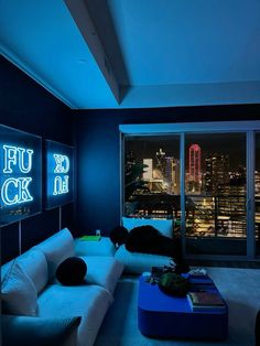 a living room filled with furniture and neon lights