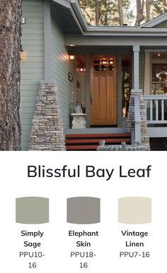 a house with the words blissful bay leaf painted on it and two different colors