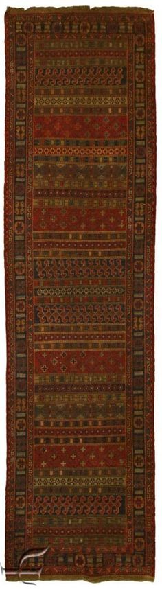 an old rug with many different colors and patterns