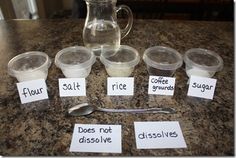 there are six cups and four spoons on the counter with labels for different types of sugar