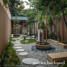 an outdoor garden with stepping stones and a water feature