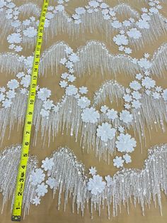 This exquisite Beaded 3D Floral Lace Fabric Embroidered on 100% Polyester Net Mesh is the perfect choice for creating unique, couture-level designs. Soft yet durable, this high quality fabric is beautifully crafted, adding texture and texture and dimension to your creations. From wedding dresses and bridal gowns to special occasion wear and dancewear, this fabric will make any design stand out. With its beading, pearls, and sequined accents, it will provide the perfect finishing touch. Shopping White Embroidered Fabric With Appliques For Party, Quinceanera Crown, Floral Lace Fabric, Lace Fabrics, Design Stand, Amazing Lace, Bridal Tiara, Gorgeous Fabrics, Off White Color