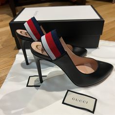 New With Box Gorgeous Gucci Heels In Black Leather. Has Red, White, And Blue Slingbacks With A Smooth Overall Leather With Pointy Almond Toe. Comes In Original Box, Two Shoe Dust Bags, Extra Heel Caps, And Care Card. Elevate Any Look With These Timeless Gucci Heels! Retails For $715. Style:524646. Message Me If You Have Any Questions! Black Leather Gucci Slingback Pumps, Gucci Black Slingback Pumps With Branded Heel, Gucci Black Slingback Pumps With Heel Strap, Gucci Black Slingback Pumps, Black Gucci Slingback Pumps With Heel Strap, Gucci Black Slingback Pumps For Party, Black Gucci Slingback Pumps For Party, Gucci Ankle Strap Slingback Pumps For Evening, Chic Black Gucci Slingback Pumps