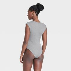 Upgrade your loungewear wardrobe with this Sleeveless Rib Bodysuit from Universal Thread™. The sleeveless bodysuit features a V-neckline and 2 X 2 ribbed construction, taking you from running errands to lunch with friends in chic style. The soft, stretchy fabric keeps you in cool comfort, while a crotch snap closure lends functional detail to your look. Pair with your favorite pair of bottoms to complete the look. Universal Thread™: Found exclusively at Target. Cotton Loungewear Bodysuit, Sleeveless Cotton Seamless Bodysuit, Sleeveless Seamless Cotton Bodysuit, Seamless Sleeveless Cotton Bodysuit, Casual Seamless Short Sleeve Bodysuit, Sleeveless Cotton Bodysuit For Loungewear, Spring Loungewear Bodysuit With Seamless Construction, Spring Sleeveless Ribbed Bodysuit, Solid Color V-neck Bodysuit For Loungewear