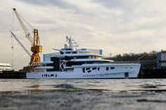 a large white boat floating on top of a body of water