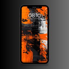 an orange and black phone with the number 8 on it's screen, in front of a dark background