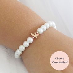 Personalized Adjustable Pearl Bracelet For Mother's Day, Personalized Adjustable Dainty Pearl Bracelet, Elegant Birthday Beaded Bracelets With Letter Beads, Elegant Personalized Rose Gold Beaded Bracelets, Elegant Personalized Rose Gold Beaded Bracelet, Elegant Pearl Bracelet With Letter Beads, White Dainty Pearl Bracelet For Birthday, Dainty White Pearl Bracelet For Birthday, Elegant White Name Bracelet For Mother's Day