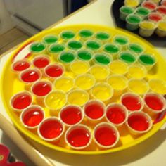 there is a plate with cupcakes on it that have different colored icing