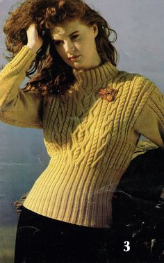 a woman in a yellow sweater and black pants posing for a magazine cover with her hand on her head