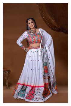 Description Introducing our White Color Muslin Cotton With Digital Print Mirror Navratri Special Lehenga Choli Made of high-quality muslin cotton, this stunning lehenga choli features a beautiful digital print and intricate mirror work, perfect for the festive season. Get ready to turn heads and make a statement with this Navratri special ensemble. About: Color White & Multi Fabric Muslin Cotton Embroidery Digital Printed Work & Real Mirror Work Chest 34 & 38 Lehenga Length 44. 5 Sleeve Length 2 Unstitched Cotton Anarkali Choli, Cotton Cutdana Lehenga For Eid, Eid Cotton Choli With Cutdana, Cotton Lehenga With Cutdana For Eid, Semi-stitched Bollywood Cotton Choli, Eid Cotton Lehenga With Cutdana, White Bohemian Sharara With Cutdana Details, White Bohemian Sharara With Cutdana, Bohemian White Sharara With Cutdana