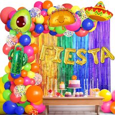 a fiesta themed birthday party with balloons and streamers