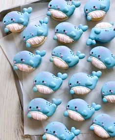 there are many decorated cookies in the shape of whales