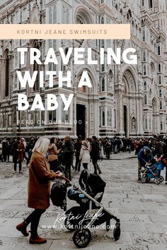 a woman pushing a stroller with the words traveling with a baby in front of an ornate building