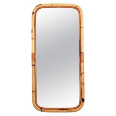 a mirror that is made out of bamboo