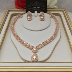 Sparkle and shine like never before with the range of cz diamanté cubic zirconia gold plated 2pcs bridal necklace set with matching earrings. This beautiful cubic zirconia encrusted necklace set is the perfect accessory  for your wedding day. Beautiful elegant, this gold cubic zirconia necklace set is filled with the dazzling sparkle. Guaranteed to transform your look in seconds to gain instant luxury, this stunning necklace set will ensure you steal every spotlight. Bring the dazzle into your o Luxury Yellow Gold Bridal Necklace With Cubic Zirconia, Luxury Yellow Gold Cubic Zirconia Bridal Necklace, Luxury Yellow Gold Bridal Necklace For Wedding, Luxury Gold Jewelry Sets For Marriage, Luxury Gold Bridal Necklace With Brilliant Cut, Luxury Gold Bridal Necklace For Rituals, Luxury Gold Dazzling Jewelry Sets, Luxury Gold Bridal Necklace With Diamante, Luxury 22k Gold Bridal Necklace For Formal Occasions