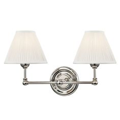 Distinctly approachable, this Mark D. Sikes Classic Double Sconce is an instant favorite. With delicate curves and a slender profile, this timeless design easily complements any aesthetic. This fixture is available in three timeless finishes with beautifully pleated shades: Aged Brass, Distressed Bronze, and Polished Nickel. Specs & Care Finish: Aged Brass, Distressed Bronze, or Polished Nickel Bulbs not included Socket Type: E12 Candelabra Base Hardwired Width/Diameter: 18.25" Height: 10.5" Ext Granite House, Mark D Sikes, Bathroom Mood Board, Silk Lampshade, Master Bathrooms, New England Style, England Style, Hudson Valley Lighting, Diffused Light