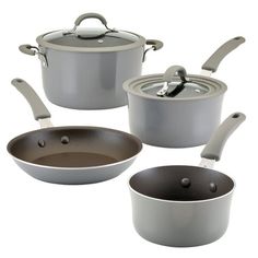 three pots and two pans with lids