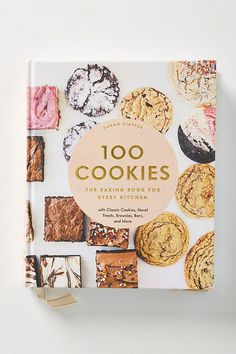 the book cover for 100 cookies is shown on a white surface with different types of cookies