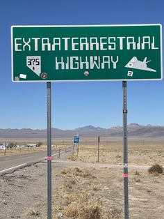 a highway sign in the middle of nowhere