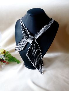 "Necklace-scarf \"Business Lady\". Classic black and white colors. Beaded tie tied bow. Beaded jewelry A gift for her Black necklace Delicate handmade jewelry Necklace made of Czech beads. Necklace circle 55 cm or 21,65 inches. If you need another color or length, email me. If you have any questions, email me. Thank you for your interest in my work." Black Ties Jewelry For Gift, Gift Black Jewelry With Ties, Black Jewelry With Ties For Gifts, Beaded Black And White Jewelry Gift, Black Bib Necklace With Colorful Beads For Gift, Elegant Handmade Black And White Jewelry, Elegant Handmade Black Bib Necklace, Adjustable Black Beaded Bib Necklace, Hand-strung Black Beaded Necklaces