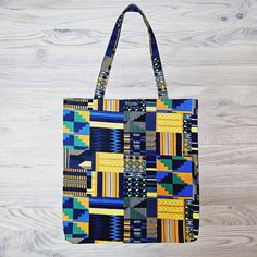 This gorgeous African Print Tote Bag/Shopper is modern, stylish, eco-friendly, durable, reusable and handcrafted with 100% quality cotton wax fabric. Keep this multifunctional Tote Bag in your handbag at all times to prevent you from constantly purchasing plastic bags at the store, take it to the park packed with toys, books etc for the kids or match this long strapped, roomy Tote Bag with your outfit and wear over the shoulder to carry your daily items. The reusable Tote Bag is light and compac Modern Blue Cotton Bags, Rectangular Cotton Shoulder Bag With Recyclable Material, Yellow Fabric Everyday Bag, Modern Cotton Rectangular Shoulder Bag, Eco-friendly Fabric Rectangular Bags, Eco-friendly Rectangular Fabric Bag, Eco-friendly Yellow Cotton Shoulder Bag, Hamam Towel, Tote Bag Beach