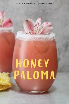 two glasses filled with honey palona and topped with flowers