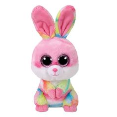 a pink stuffed animal with big eyes and a rainbow colored bunny outfit on it's chest