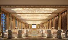 an elegant banquet hall with chandeliers and tables set for a formal dinner or function