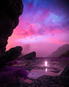 the sky is pink and purple with stars in it, as well as some rocks