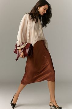 A slip skirt in the truest sense, the on-trend Tilda keeps it simply chic with a French-inspired bias-cut design that makes it drape and move just so . | The Tilda Slip Skirt: Shine Edition by Anthropologie in Brown, Women's, Size: Largearge, Polyester Slip Skirt Outfit, Anthro Style, Dark Autumn, Satin Short, Simply Chic, Slip Skirt, Midi Skirts, Trendy Clothes For Women, Lovely Dresses