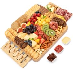 an assortment of cheeses, fruit and crackers on a platter