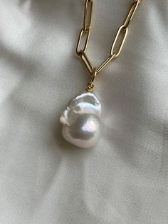 This baroque pearl pendant necklace is gorgeous, the pearl is AAA quality, nice irregular shape! Seriously beautiful, smooth, and super lustrous baroque pearl! The paper clip chain is anti tarnish with a gold filled lobster lock! Note: necklace on images shown sold, this is now a custom order. Pearl shape and size may vary but will be more or less be the same size and quality. This handmade Baroque Pearl Pendant gold chain necklace is simple, minimalist. The genuine cultured baroque or flameball Classic Baroque Necklace For Gift, Baroque Pearl Drop Necklace For Gift, Baroque Pearl Jewelry Gift, Baroque Pearl Necklace In Pear Shape As Gift, Pear-shaped Baroque Pearl Necklace As Gift, Pear-shaped Baroque Pearl Necklace Gift, Baroque Pearl Charm Necklace For Gifts, Teardrop Baroque Pearl Necklace For Gifts, Baroque Pearl Pendant