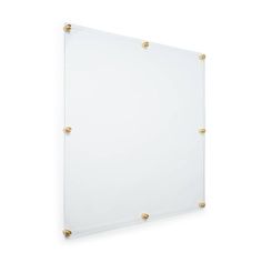 a white glass board with gold studdings on the edges and bottom, against a white background