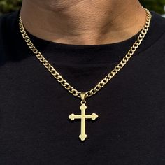 This elegant medium solid crucifix pendant is a timeless and versatile accessory that can be worn for any occasion. It is made of gold-plated alloy and comes with a 5mm Cuban chain or 4mm Rope chain. The pendant is approximately 1.5 inches wide and 2 inches long. Features: Chain Length - Cuban Chain- 22 inches - Rope Chaim- 20 inches - Material: Gold plated alloy - Dimensions: Approx. 1.5 inches width and 2 inches length - Includes: 5mm Cuban chain or 4mm Rope chain - A thoughtful gift for a lov Gold Cross Necklace With Figaro Chain, Gold Cross Figaro Chain Necklace, Gold Figaro Chain Cross Necklace, Gold Figaro Chain Necklace With Cross Pendant, Gold Figaro Chain Necklace With Cross Shape, Gold Cross Necklace With Curb Chain, Gold Cross Chain Necklace With Curb Chain, Gold Curb Chain Necklace With Cross Shape, Gold Tarnish-resistant Cross Pendant Necklace