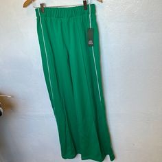 New With Tags Green Track Flare Pants Spring Sporty Wide Leg Pants, Sporty Wide-leg Pants For Spring, Sporty Full Length Bottoms For Spring, Sporty Spring Pants, Sporty Straight Pants For Spring, Sporty Wide Leg Pants For Spring Workwear, Sporty Wide-leg Pants For Spring Workwear, Sporty Trousers For Spring, Sporty Ankle-length Spring Pants