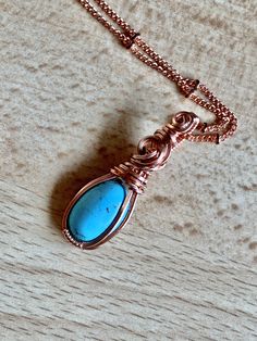 Turquoise and copper is such a beautiful combination, each color enhancing the other. This small, but boldly colored pendant shows off the copper/turquoise combo perfectly. This 10x14 natural turquoise oval cabochon is hand wrapped with bare copper wire. The pendant measures 1 3/8 inches in length (top of bail to bottom) and nearly 1/2 inch in width at the widest point of the pendant. Base wire is 20 gauge square wire and the smaller wrapping wire is 22 gauge half round wire. The pendant comes w Handmade Turquoise Copper Wire Necklace, Handmade Turquoise Necklace With Copper Wire, Turquoise Necklace With Copper Wire, Spiritual Electroformed Turquoise Jewelry, Turquoise Pendant Necklace Wire Wrapped, Turquoise Wire Wrapped Pendant Necklace, Wire Wrapped Turquoise Pendant Necklace, Handmade Copper Turquoise Jewelry, Handmade Copper Turquoise Necklace As Gift